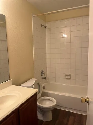 a bathroom with a sink a toilet and a bathtub