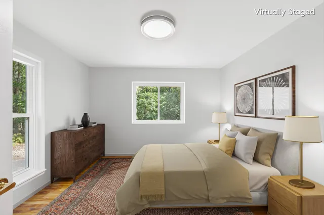 a bedroom with a bed and window