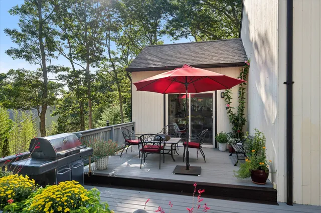 an outdoor space with furniture and umbrella