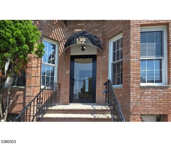 a black and white photo of a house