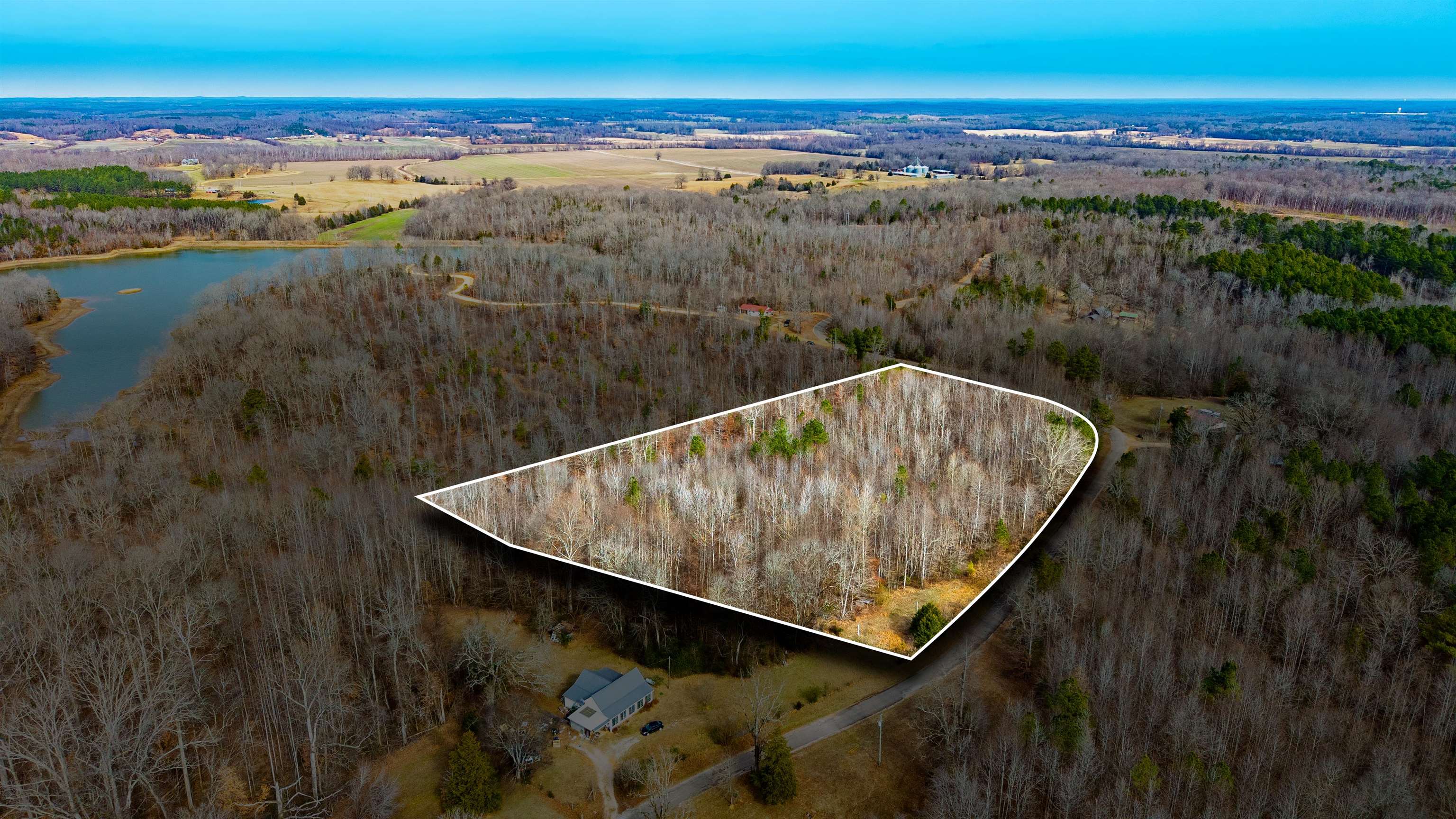 150 Stafford Bottoms Road Adamsville, TN 38310 - Photo 4 of 23 Aerial view of property's location with a nearby body of water and property boundaries highlighted