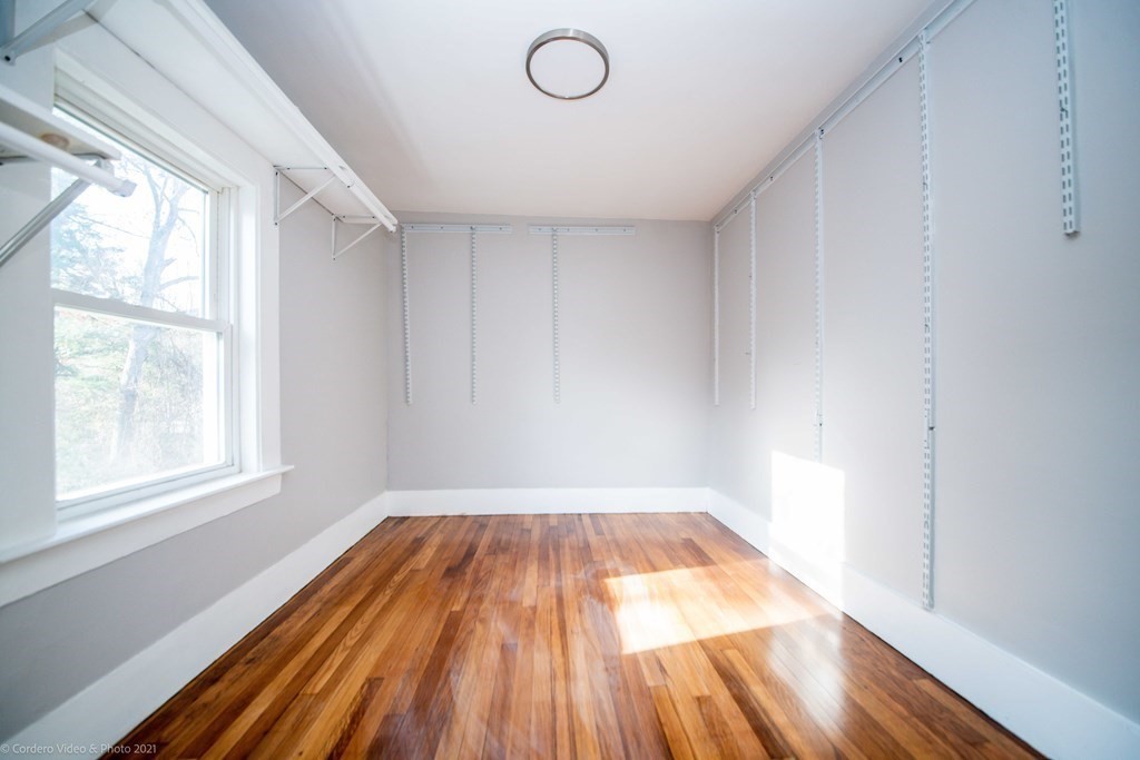 67 Wareham Road Marion, MA 02738 - Photo 15 of 29 a view of empty room with wooden floor and fan