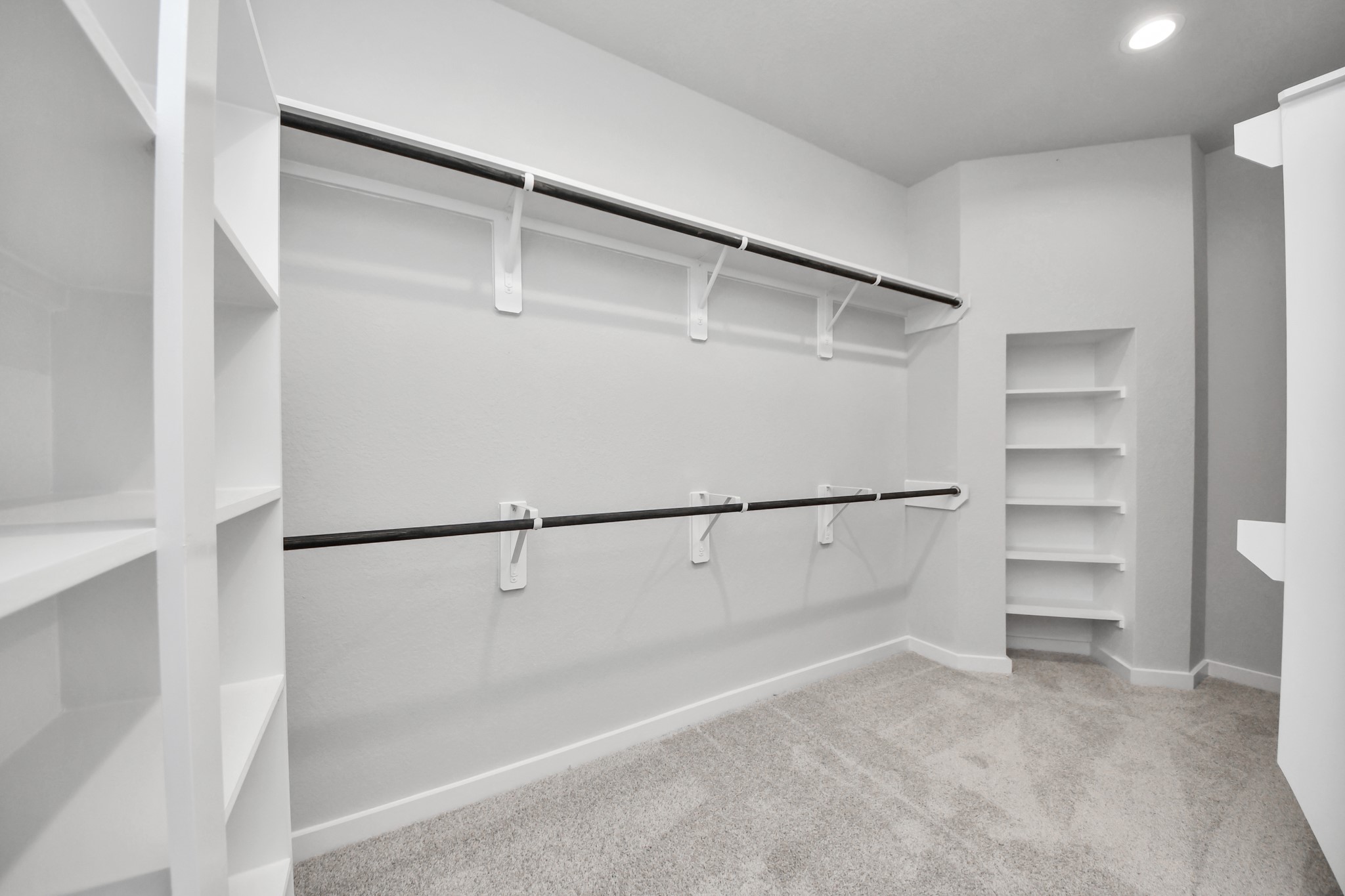 11122 Tulip Rdg Trail Houston, TX 77044 - Photo 24 of 34 a view of walk in closet with empty racks