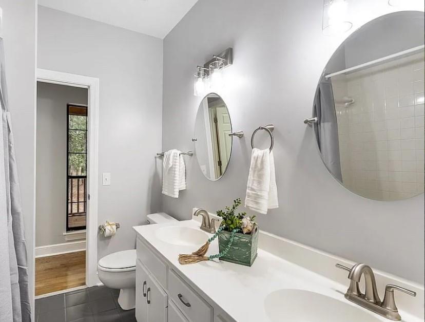 1525 Black Island Road Darien, GA 31305 - Photo 14 of 41 a bathroom with a toilet sink and mirror