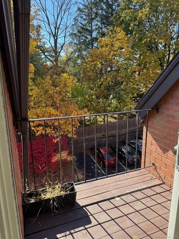 a view of a balcony with a potted plants