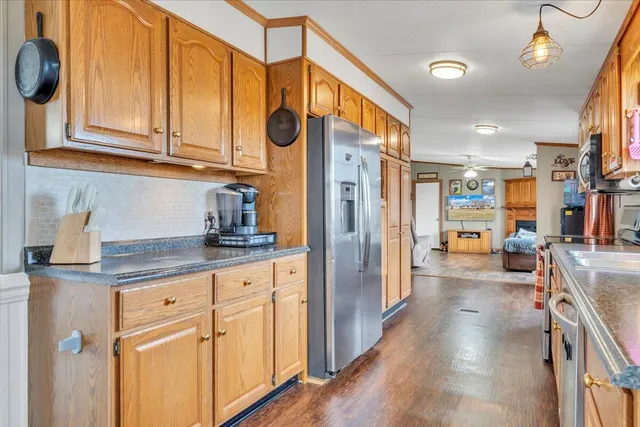 a view of a kitchen cabinets and wooden floor