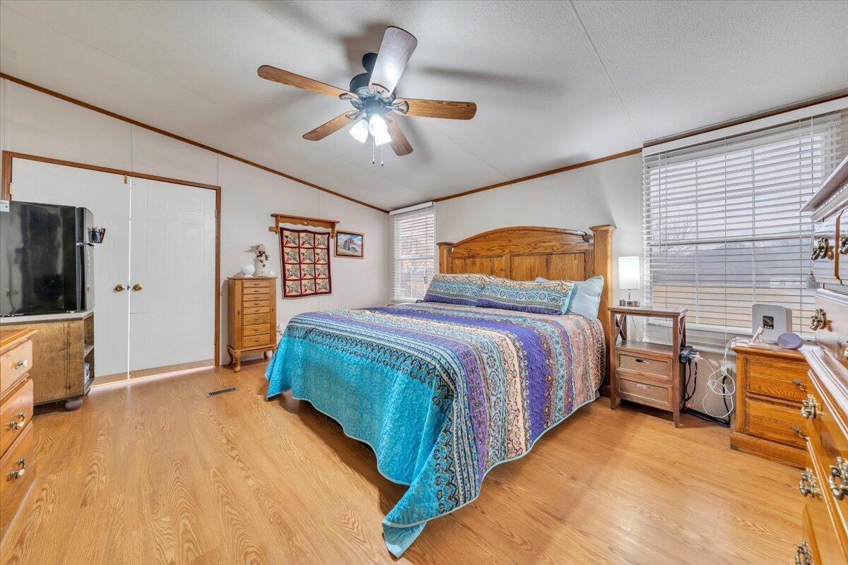 627-641 Novelty Road Penhook, VA 24137 - Photo 25 of 69 a bedroom with a bed dresser and wooden floor