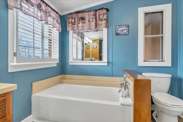 a bathroom with a sink and a window