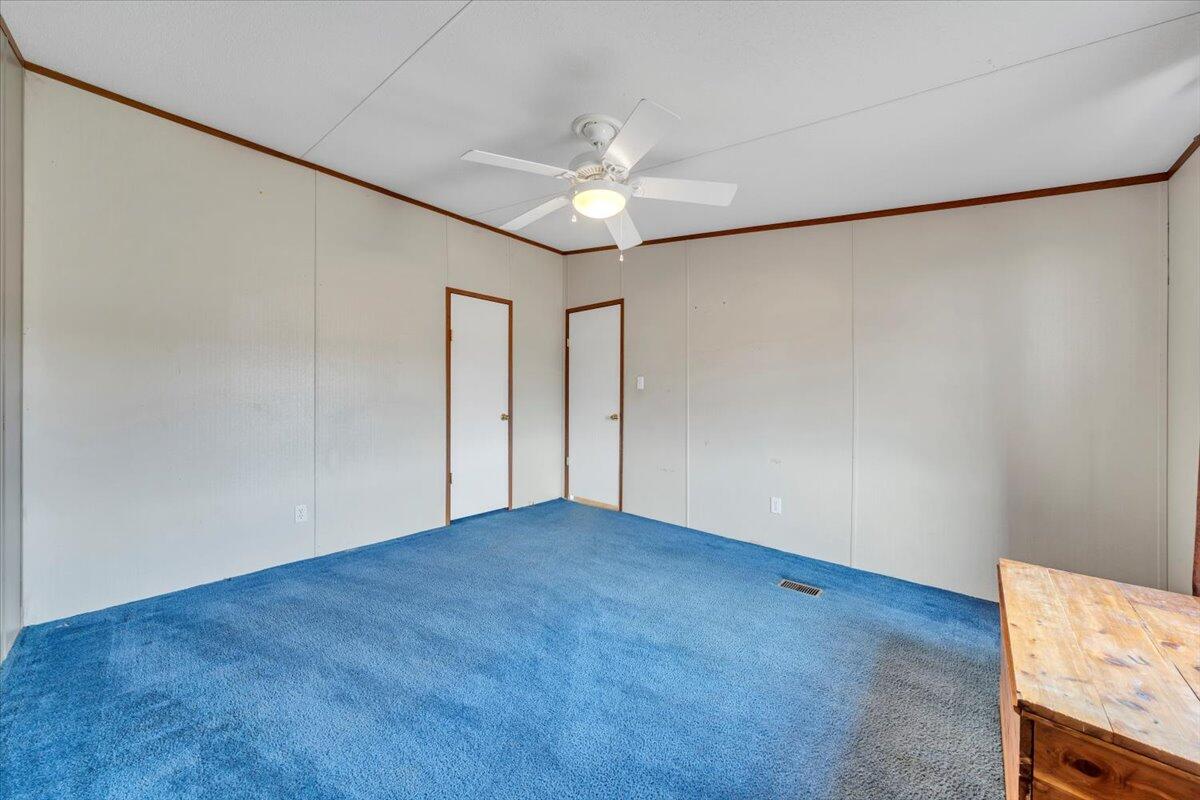 627-641 Novelty Road Penhook, VA 24137 - Photo 34 of 69 a view of an empty room with a ceiling fan