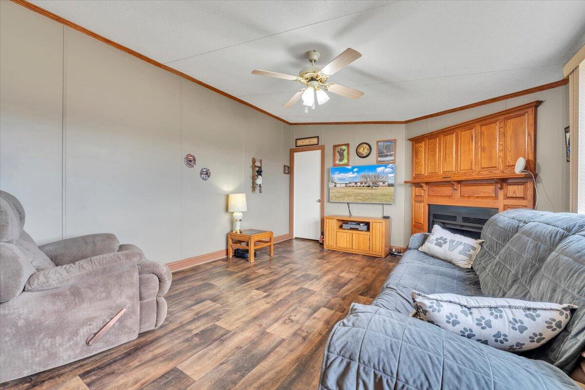 627-641 Novelty Road Penhook, VA 24137 - Photo 41 of 69 a living room with furniture and a flat screen tv