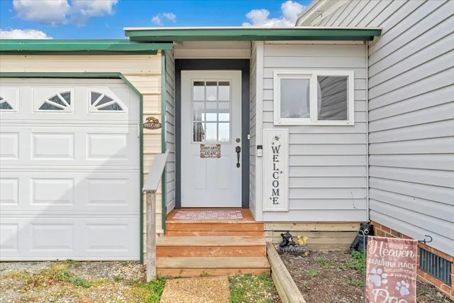 a view of a dry yard with wooden fence