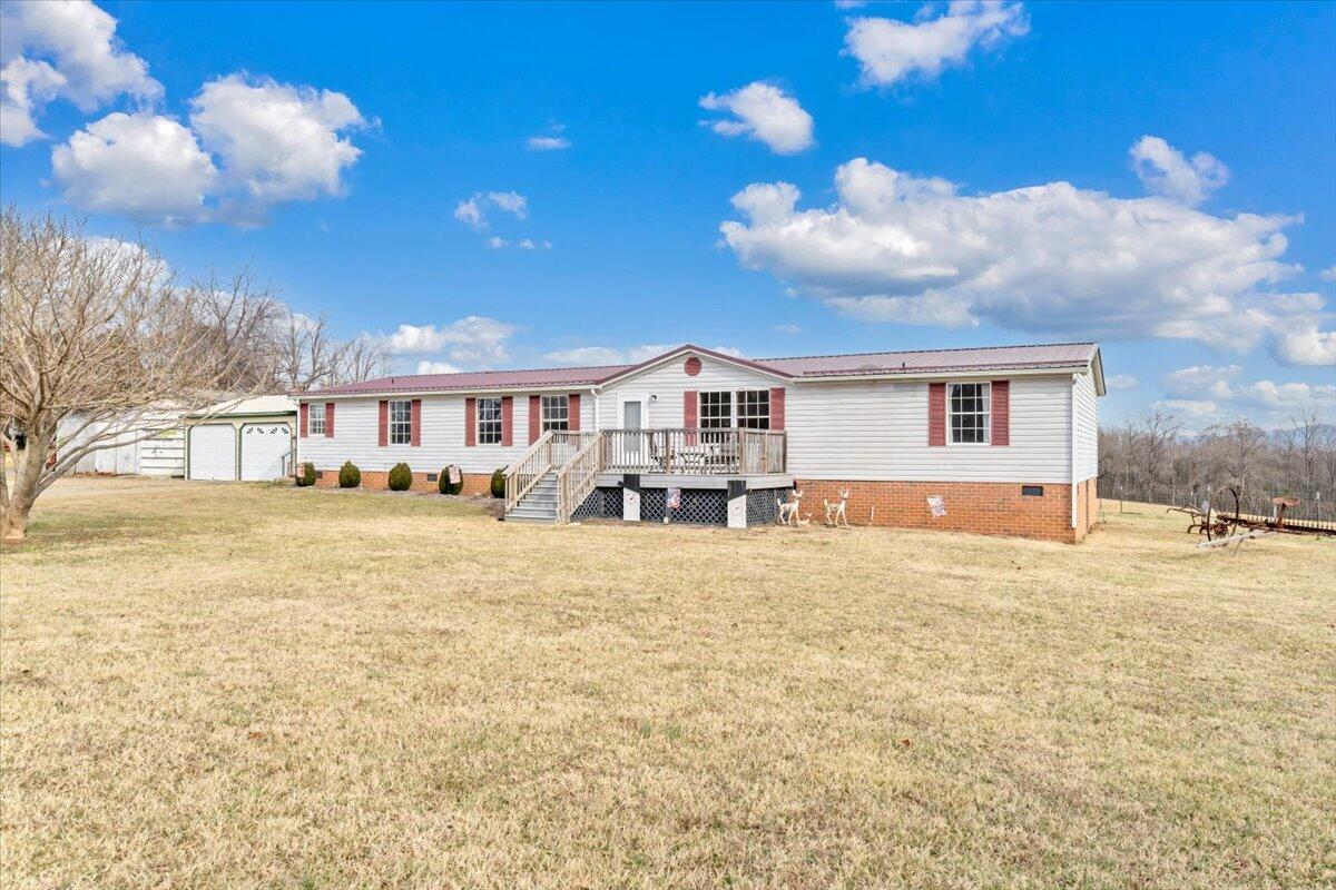 627-641 Novelty Road Penhook, VA 24137 - Photo 50 of 69 a front view of a house with a yard and garage