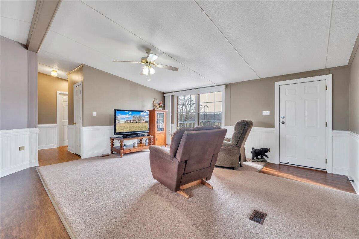 627-641 Novelty Road Penhook, VA 24137 - Photo 6 of 69 a living room with furniture and a flat screen tv