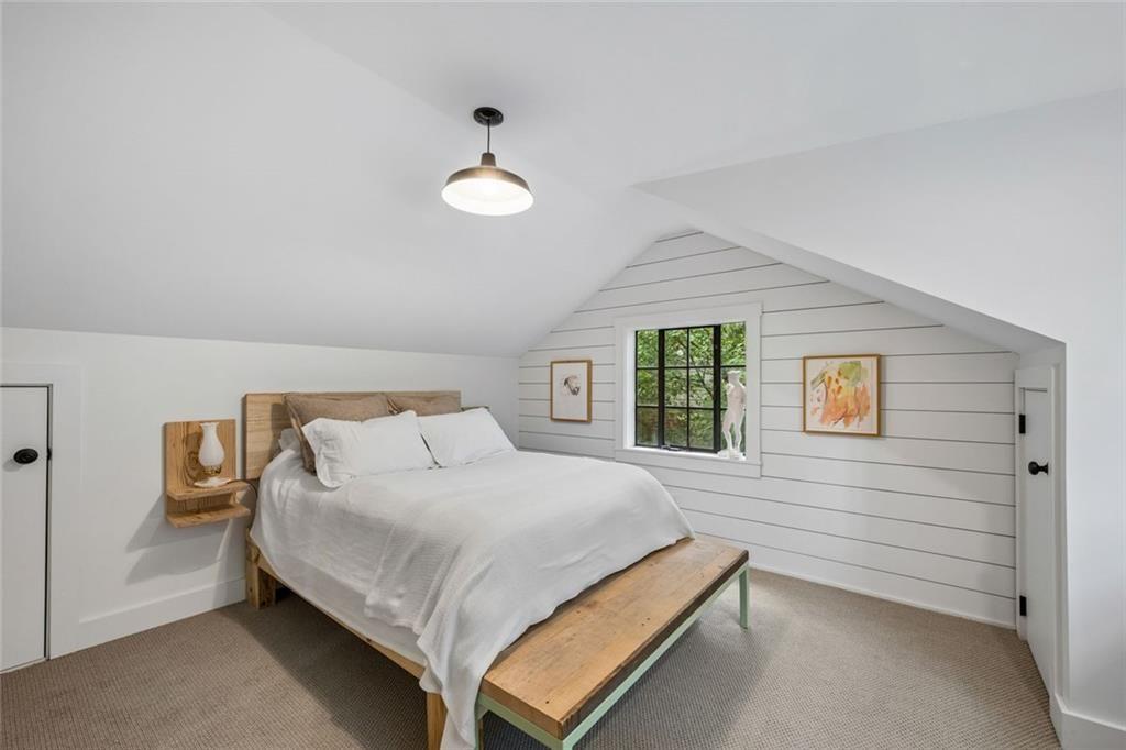 2069 Edinburgh Terrace Northeast Atlanta, GA 30307 - Photo 30 of 72 a bedroom with a bed and a window