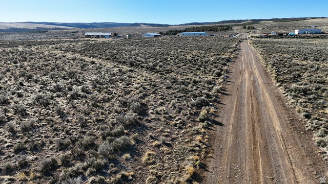 230 East D D Holw Road Panguitch, UT 84759 - Photo 11 of 37 View of rural area with a mountain backdrop and farmland