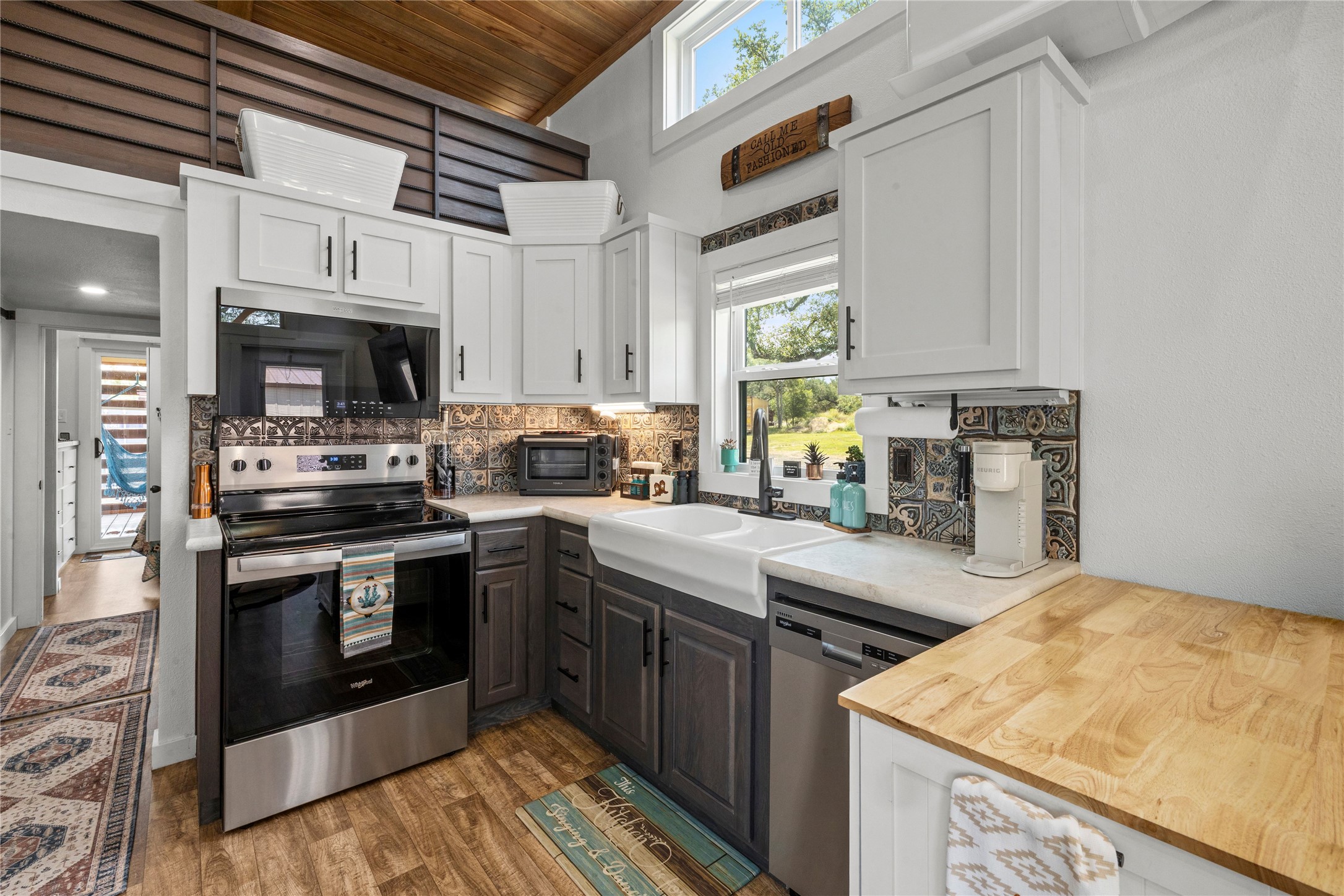 8200 Ranch Road 12 San Marcos, TX 78666 - Photo 14 of 40 Culinary creations come alive in this kitchen, featuring an electric range and classic farmhouse sink.