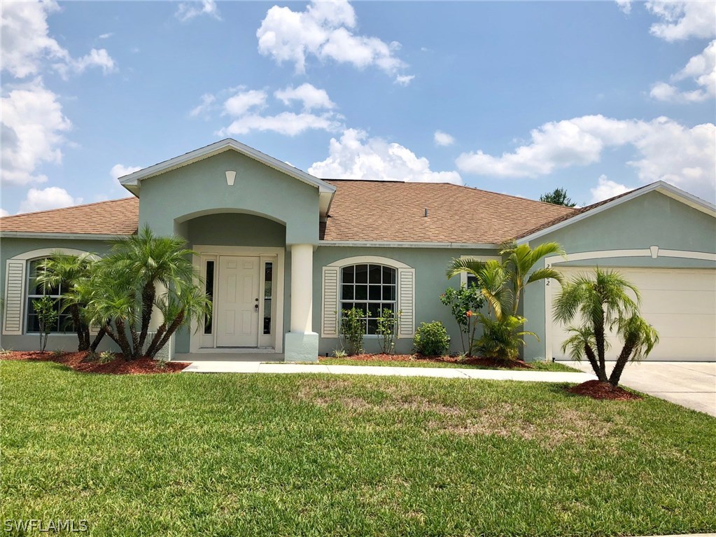 2502 Nature Pointe Loop Fort Myers, FL 33905 - Photo 1 of 5 a front view of a house with a yard
