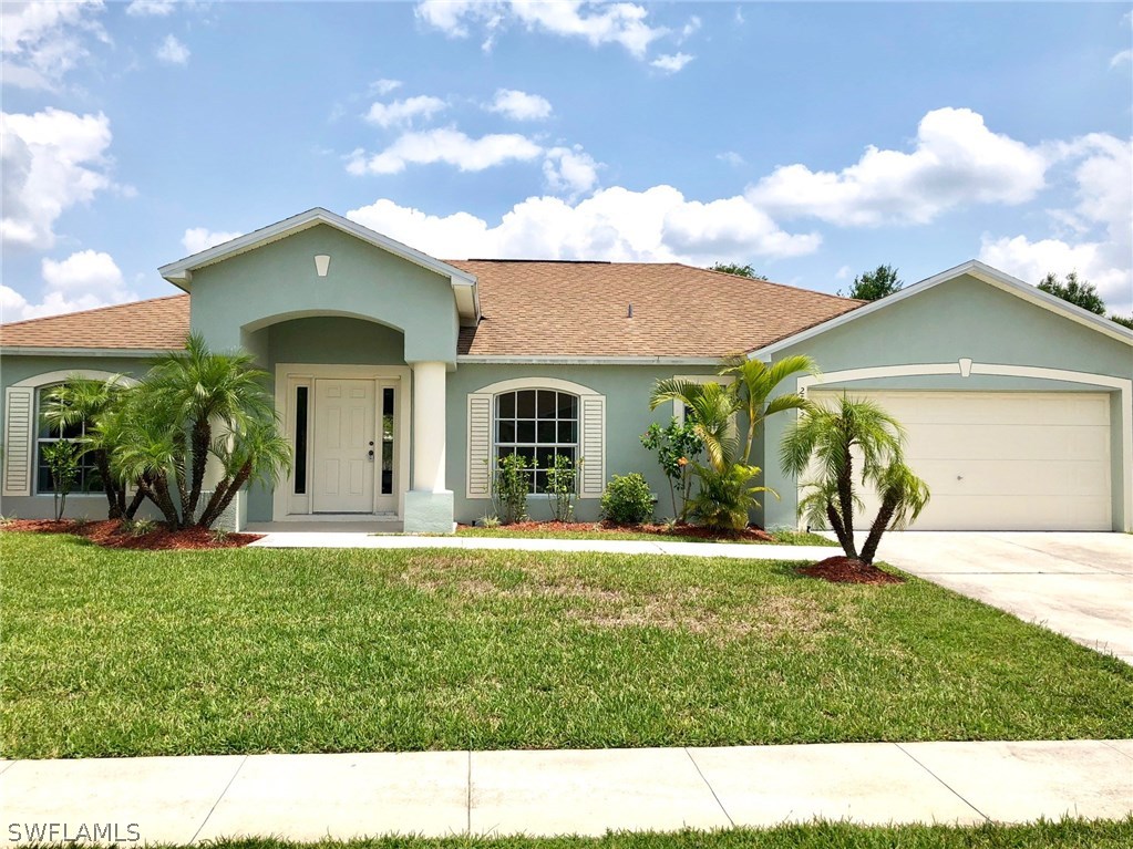 2502 Nature Pointe Loop Fort Myers, FL 33905 - Photo 2 of 5 a view of a house with a yard