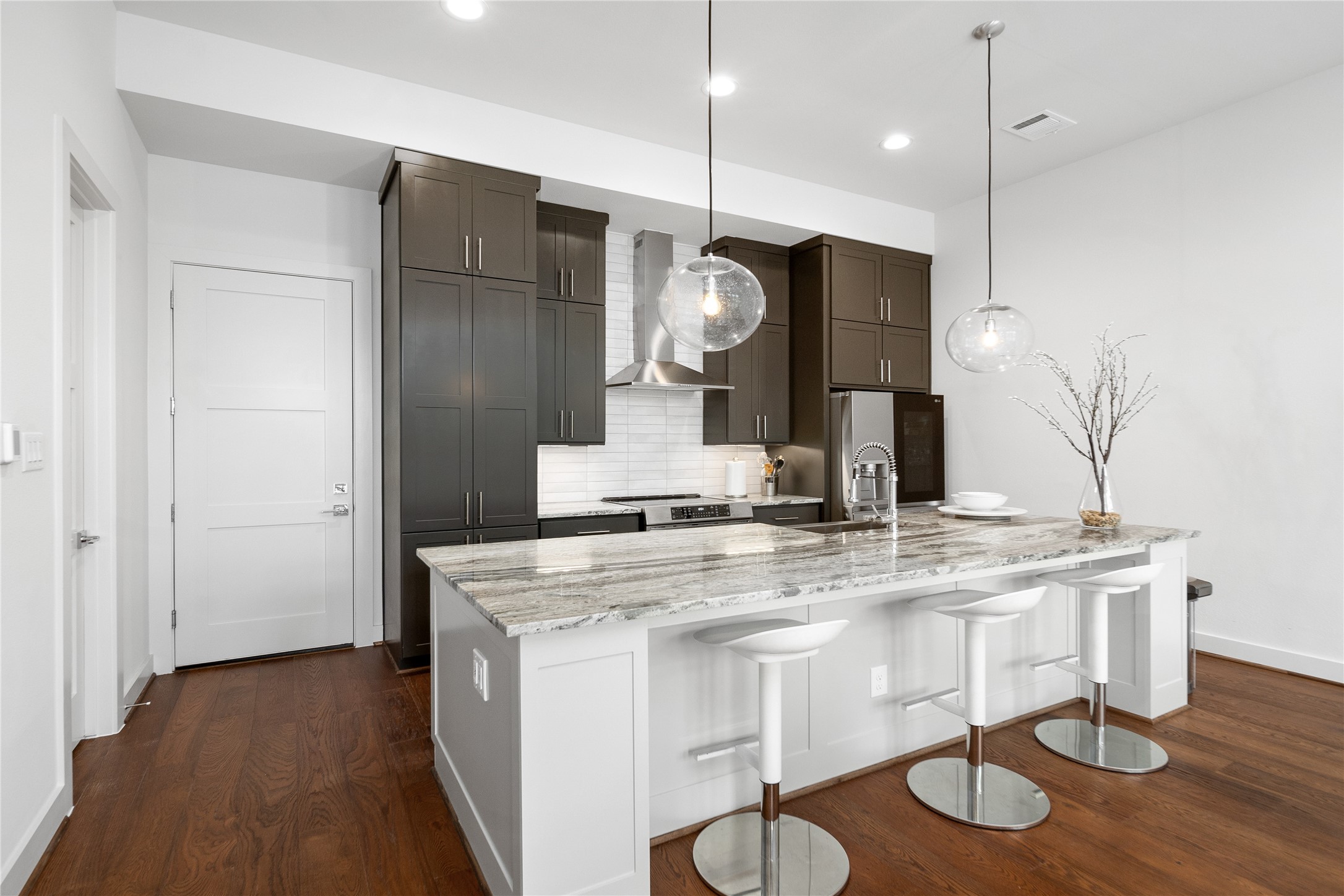 2408 Gray Street Houston, TX 77003 - Photo 5 of 23 a kitchen with kitchen island a counter space a sink and appliances