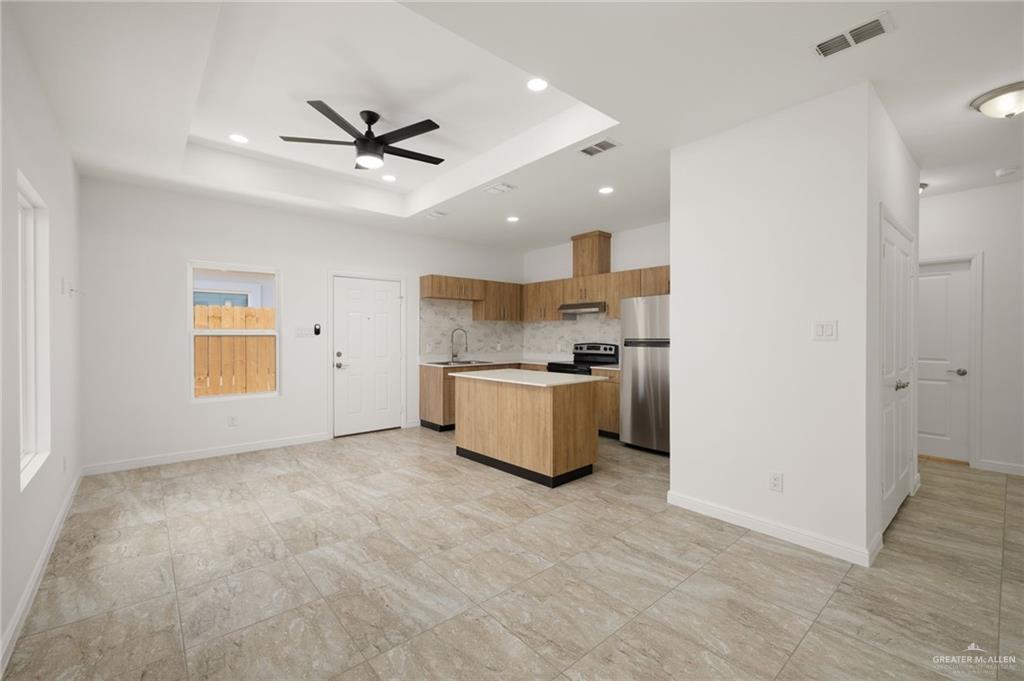 5304 Vision Street Rio Grande City, TX 78582 - Photo 11 of 26 a view of a kitchen with a sink and a refrigerator