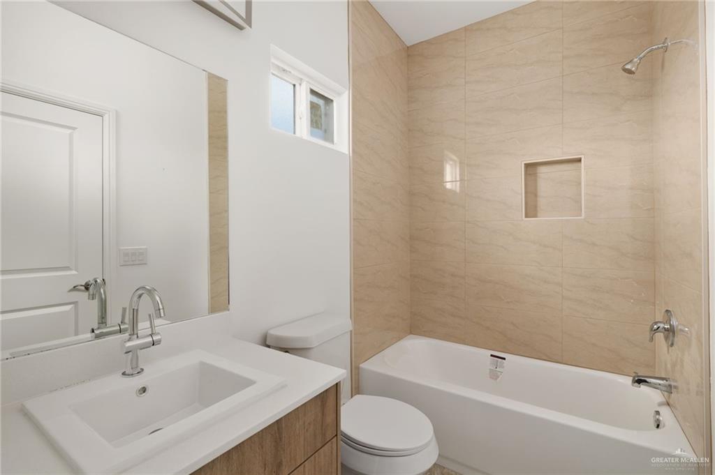 5304 Vision Street Rio Grande City, TX 78582 - Photo 15 of 26 a bathroom with a sink toilet and shower