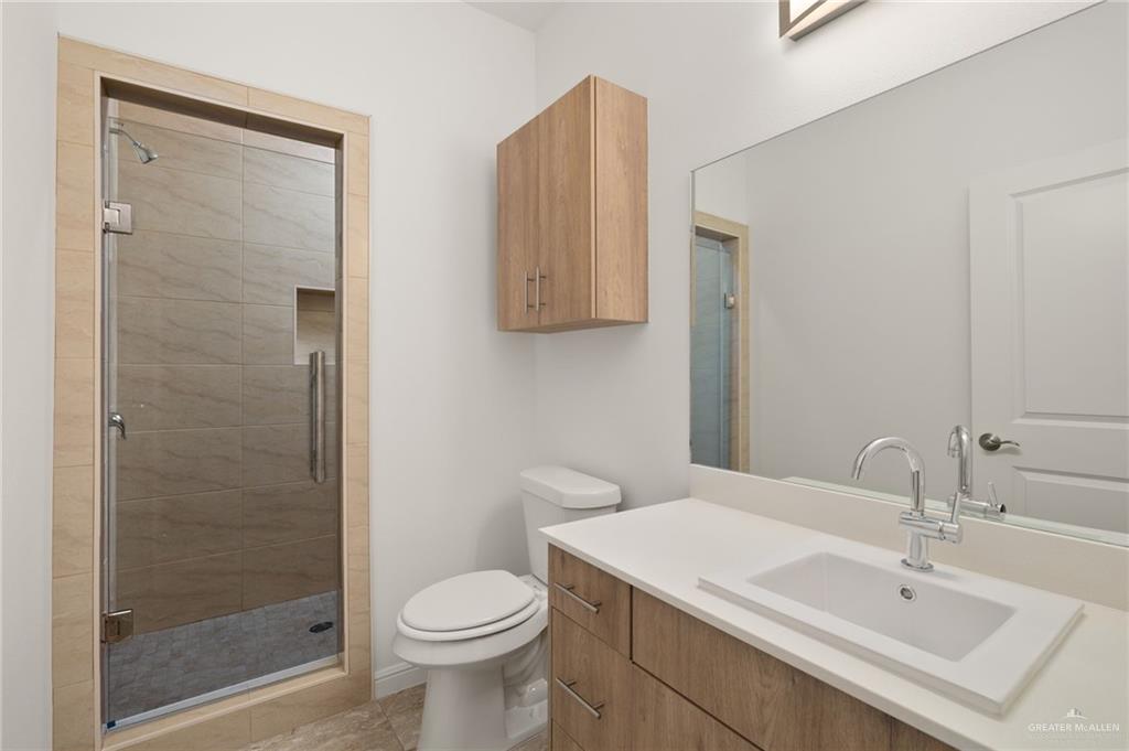 5304 Vision Street Rio Grande City, TX 78582 - Photo 7 of 26 a bathroom with a sink toilet and shower