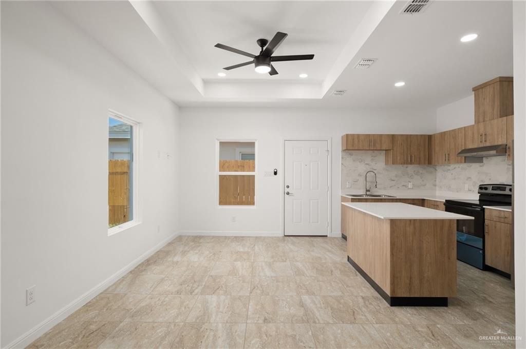 5304 Vision Street Rio Grande City, TX 78582 - Photo 10 of 26 a view of a kitchen with a sink and a stove top oven