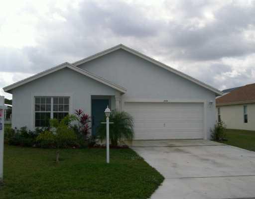 a house with a yard and a garage