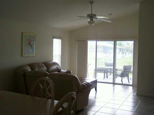 2434 Southwest Malibu Way Stuart, FL 34997 - Photo 4 of 8 a living room with furniture and a window