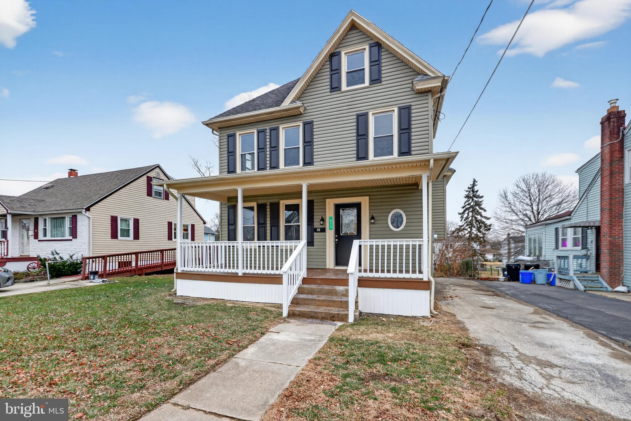 312 West Monroe Avenue Magnolia, NJ 08049 - Photo 1 of 43 a front view of a house with a yard