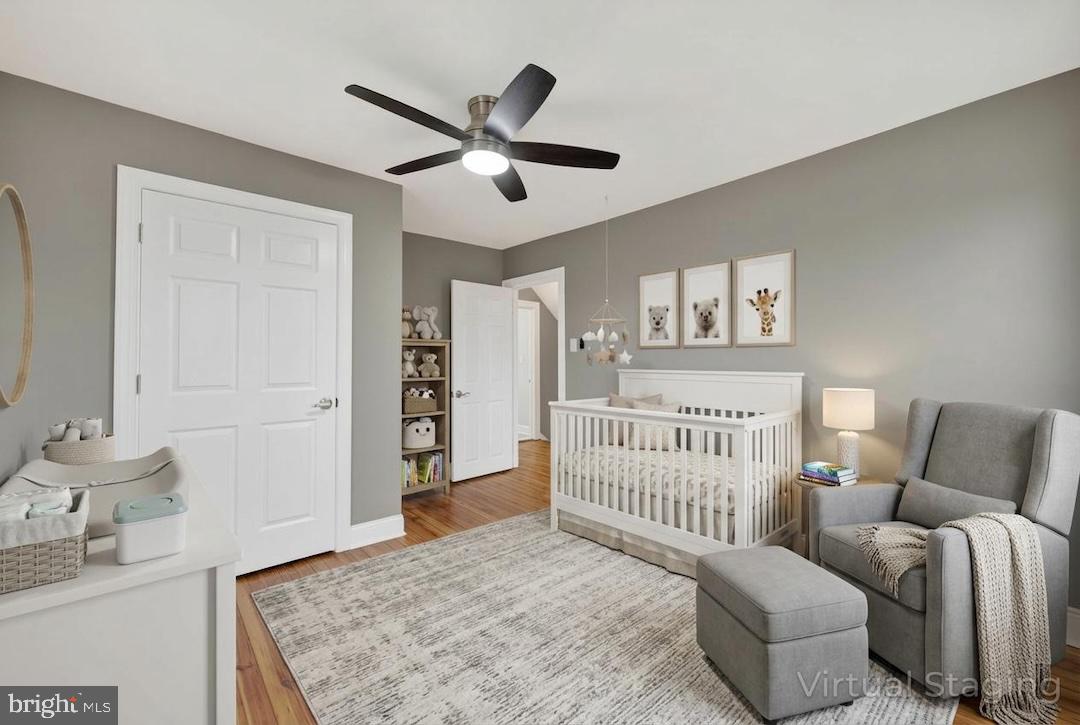 312 West Monroe Avenue Magnolia, NJ 08049 - Photo 11 of 43 a bedroom with furniture and wooden floor