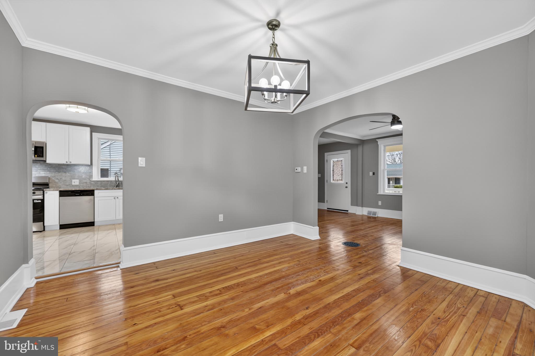 312 West Monroe Avenue Magnolia, NJ 08049 - Photo 20 of 43 a view of a hallway with wooden floor and a kitchen