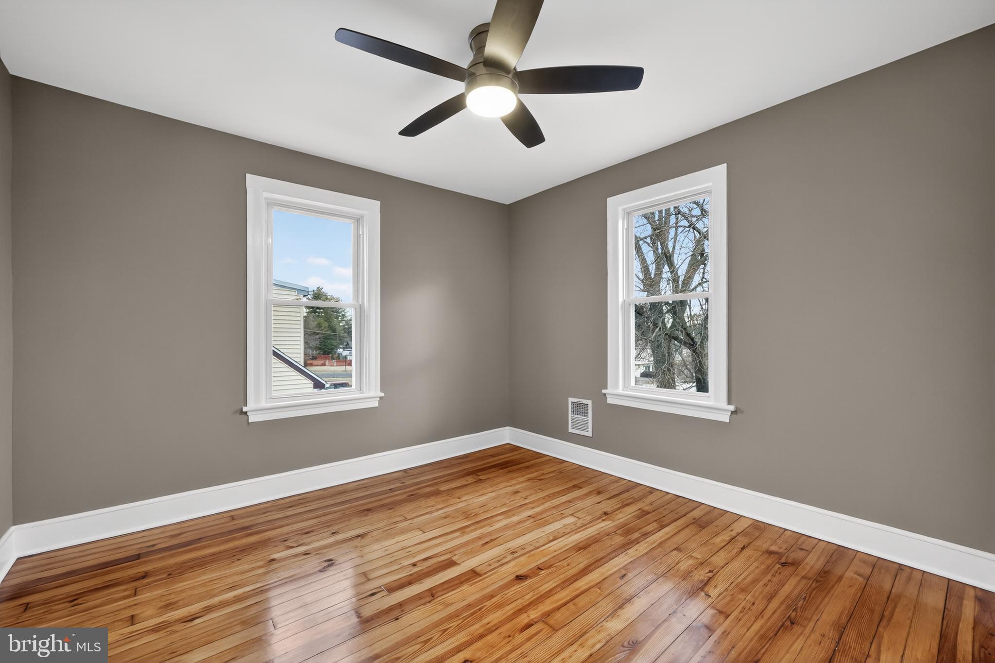 312 West Monroe Avenue Magnolia, NJ 08049 - Photo 29 of 43 a view of empty room with wooden floor and fan