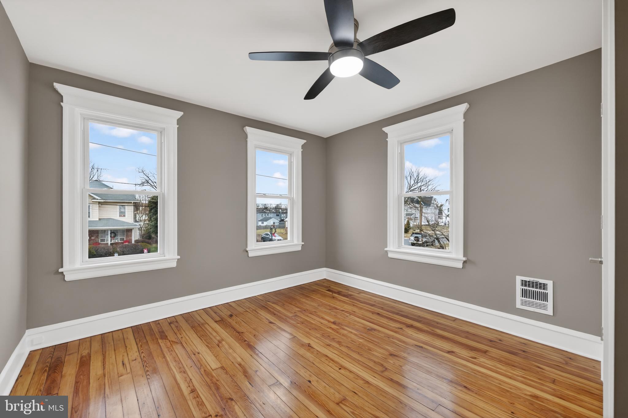 312 West Monroe Avenue Magnolia, NJ 08049 - Photo 30 of 43 a view of an empty room with wooden floor and a window