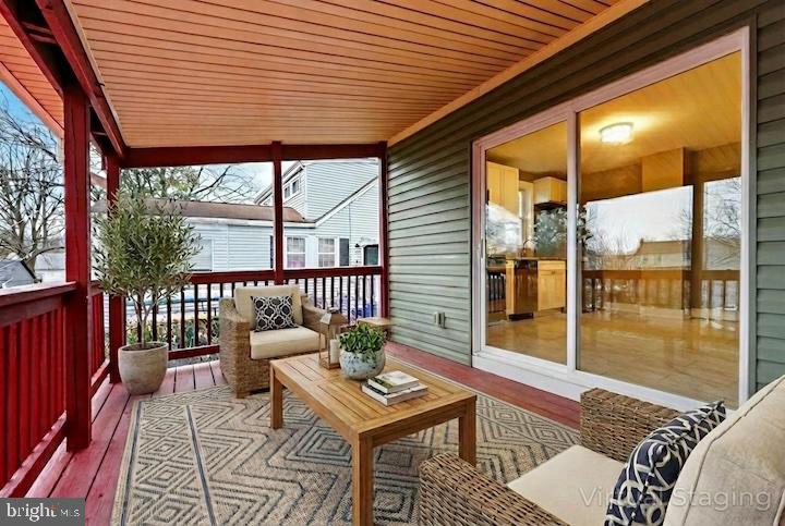 312 West Monroe Avenue Magnolia, NJ 08049 - Photo 3 of 43 a balcony with furniture and a potted plant