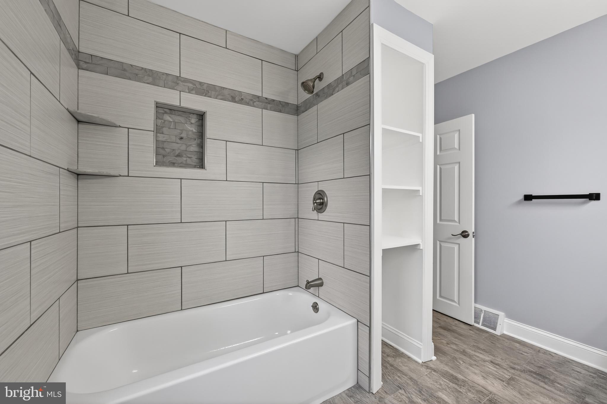312 West Monroe Avenue Magnolia, NJ 08049 - Photo 31 of 43 a bathroom with a bathtub and shower