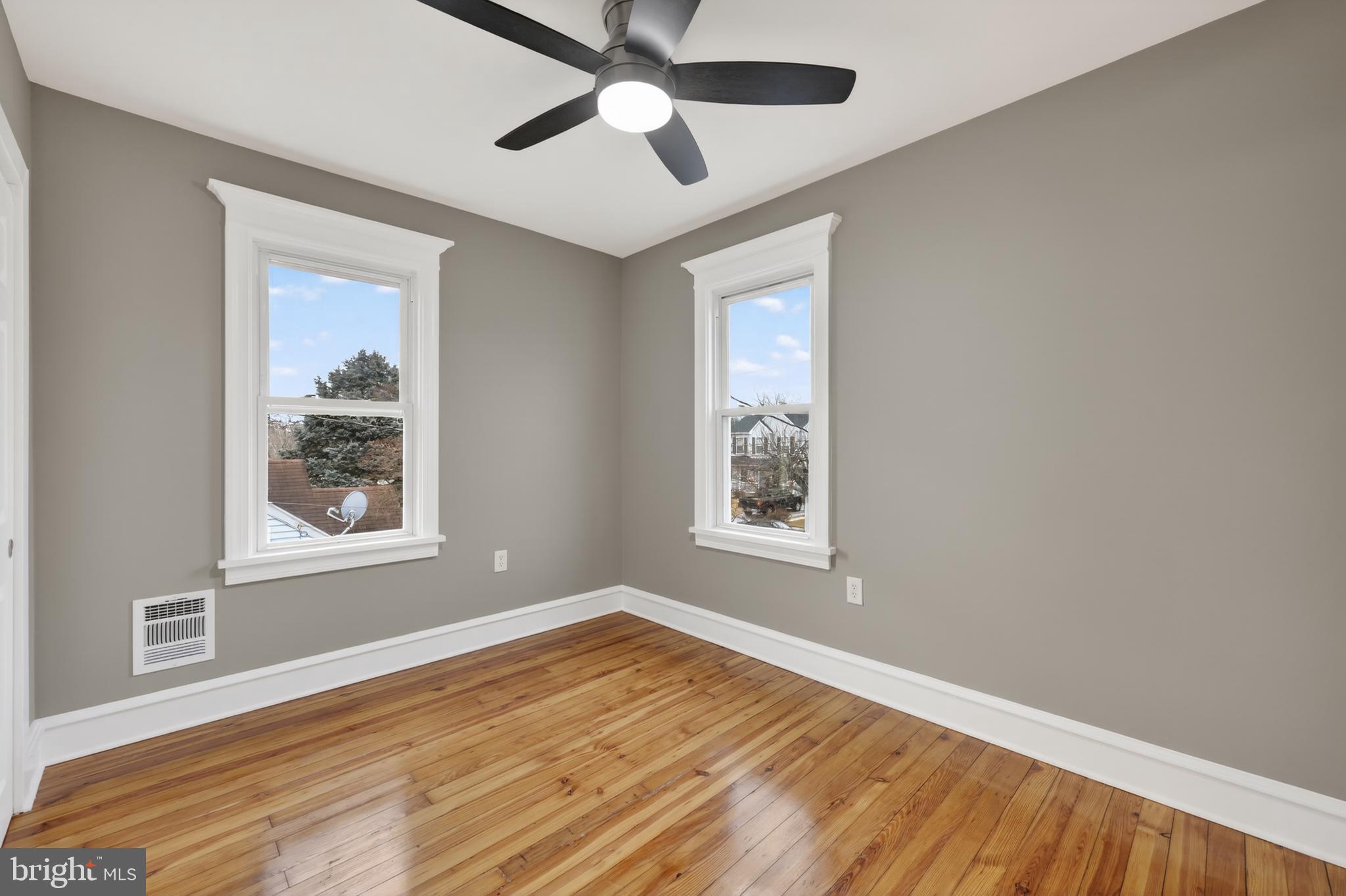 312 West Monroe Avenue Magnolia, NJ 08049 - Photo 32 of 43 a view of an empty room with wooden floor and a window