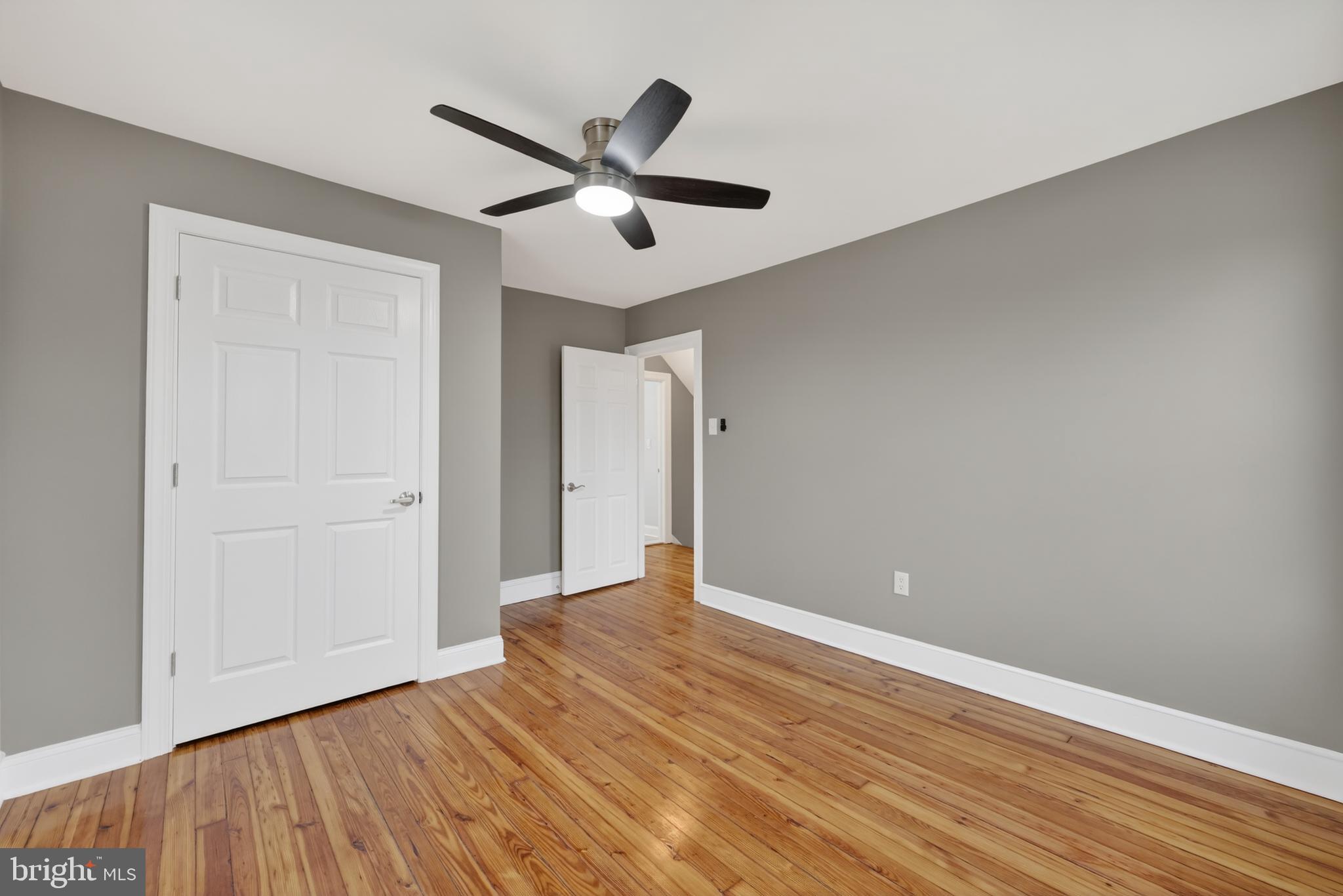 312 West Monroe Avenue Magnolia, NJ 08049 - Photo 35 of 43 an empty room with wooden floor and windows