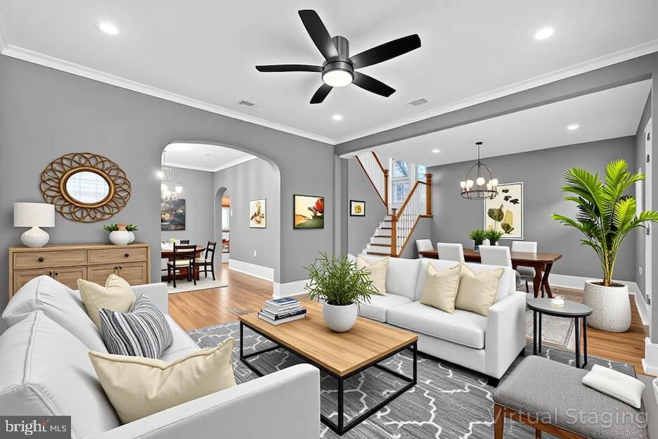 312 West Monroe Avenue Magnolia, NJ 08049 - Photo 6 of 43 a living room with furniture a chandelier and a potted plant