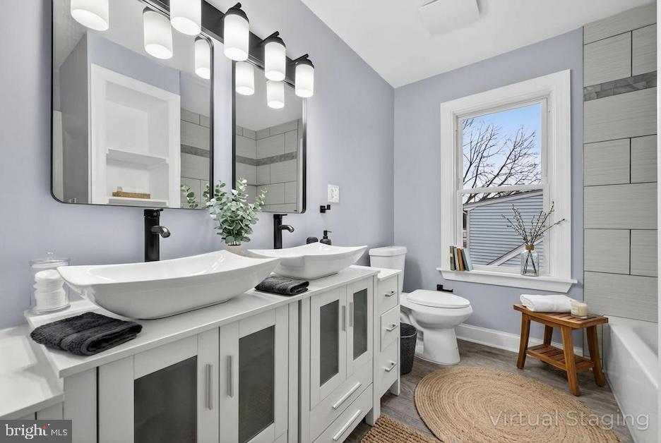 312 West Monroe Avenue Magnolia, NJ 08049 - Photo 9 of 43 a spacious bathroom with a sink a toilet and a mirror