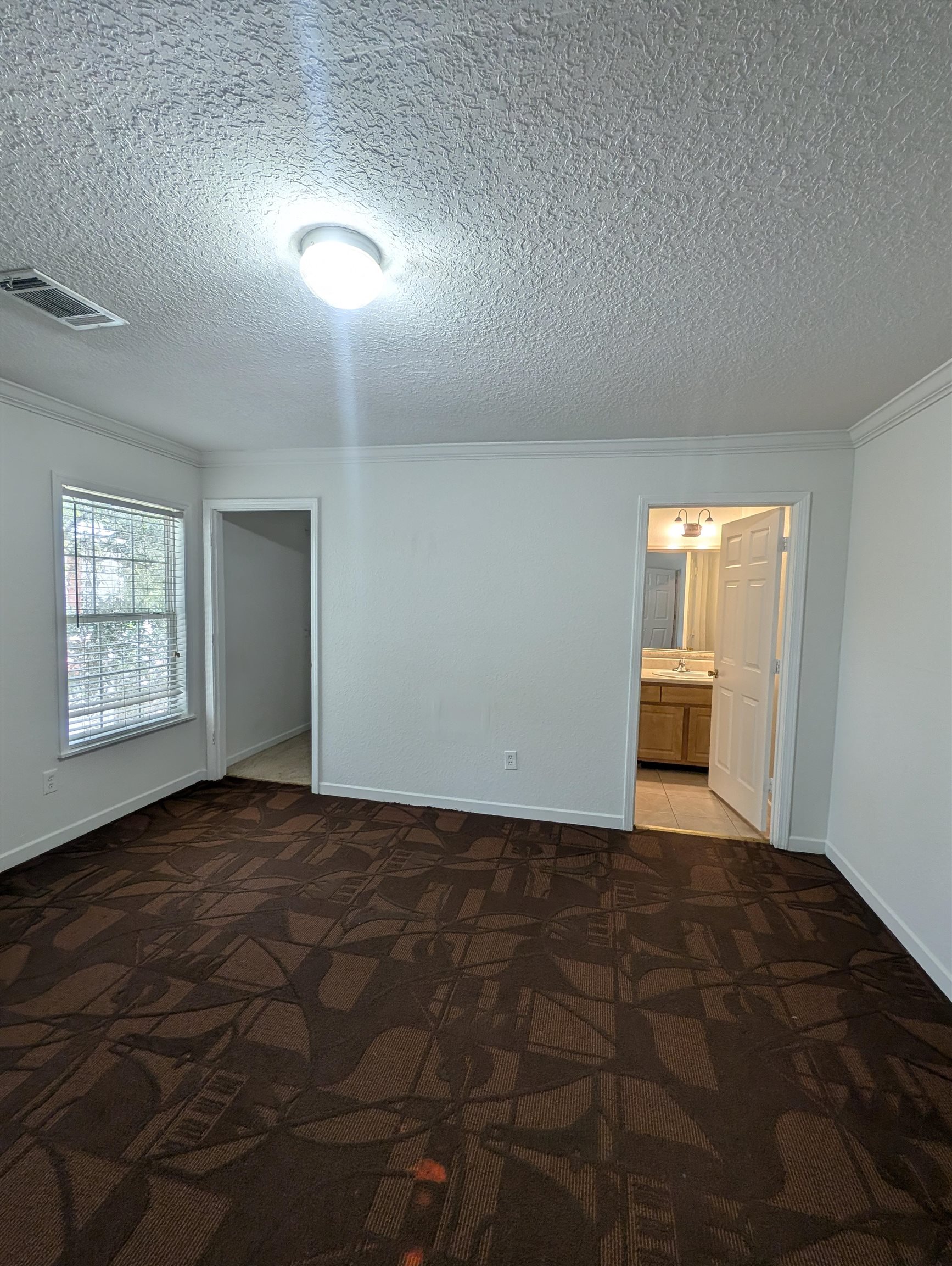 114 Cedar Street, Unit 4 St. Augustine, FL 32084 - Photo 18 of 33 a view of an empty room and window