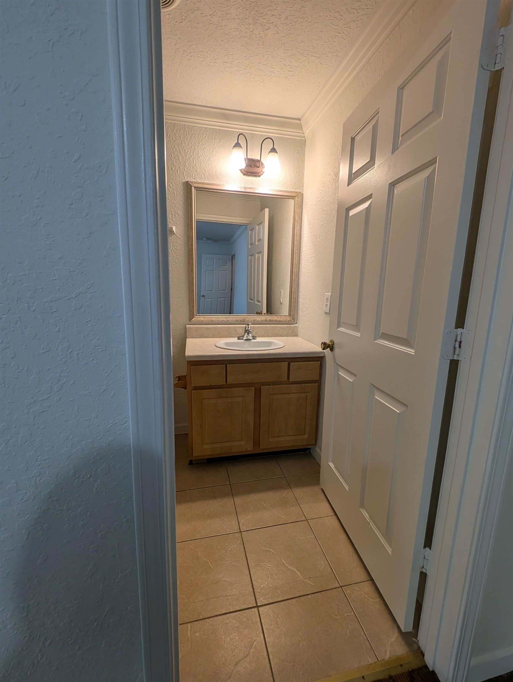 114 Cedar Street, Unit 4 St. Augustine, FL 32084 - Photo 20 of 33 a bathroom with a sink a mirror and a toilet