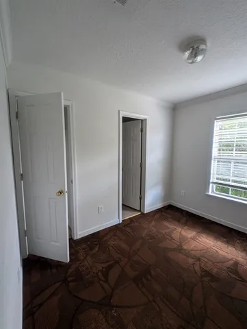 a view of a bathroom from a hallway
