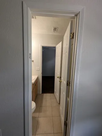 a bathroom with a toilet a sink and shower