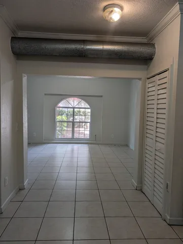 a view of an empty room and window