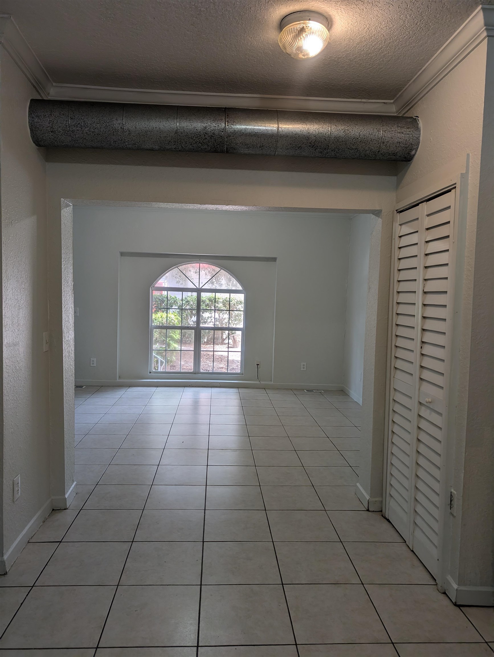 114 Cedar Street, Unit 4 St. Augustine, FL 32084 - Photo 6 of 33 a view of an empty room and window