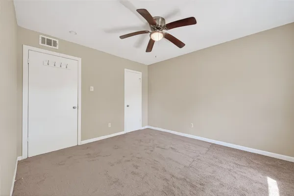 a view of a big room with carpet