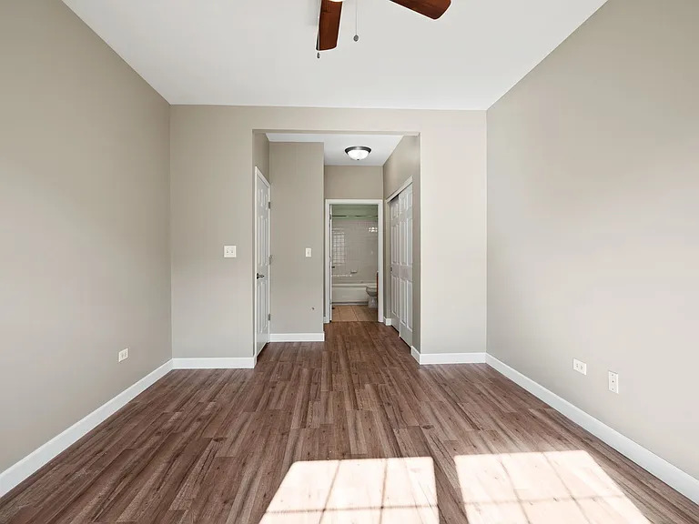 2568 Golf Ridge Circle, Unit 2568 Naperville, IL 60563 - Photo 11 of 18 a view of a big room with wooden floor and windows