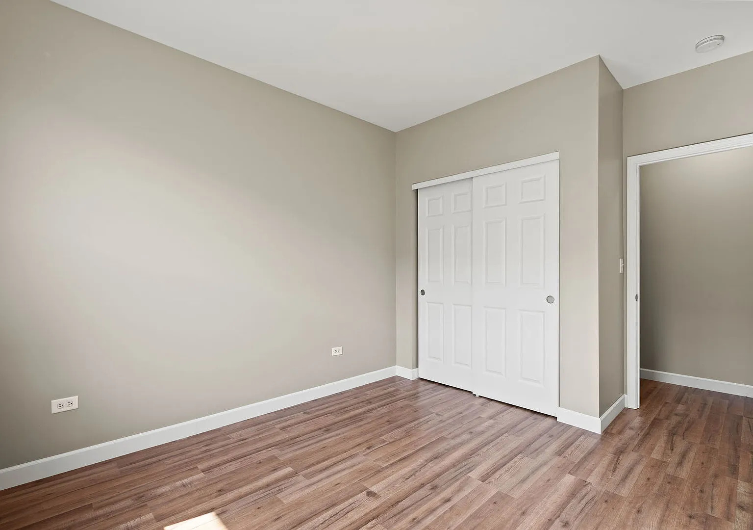 2568 Golf Ridge Circle, Unit 2568 Naperville, IL 60563 - Photo 13 of 18 a view of an empty room with wooden floor and closet