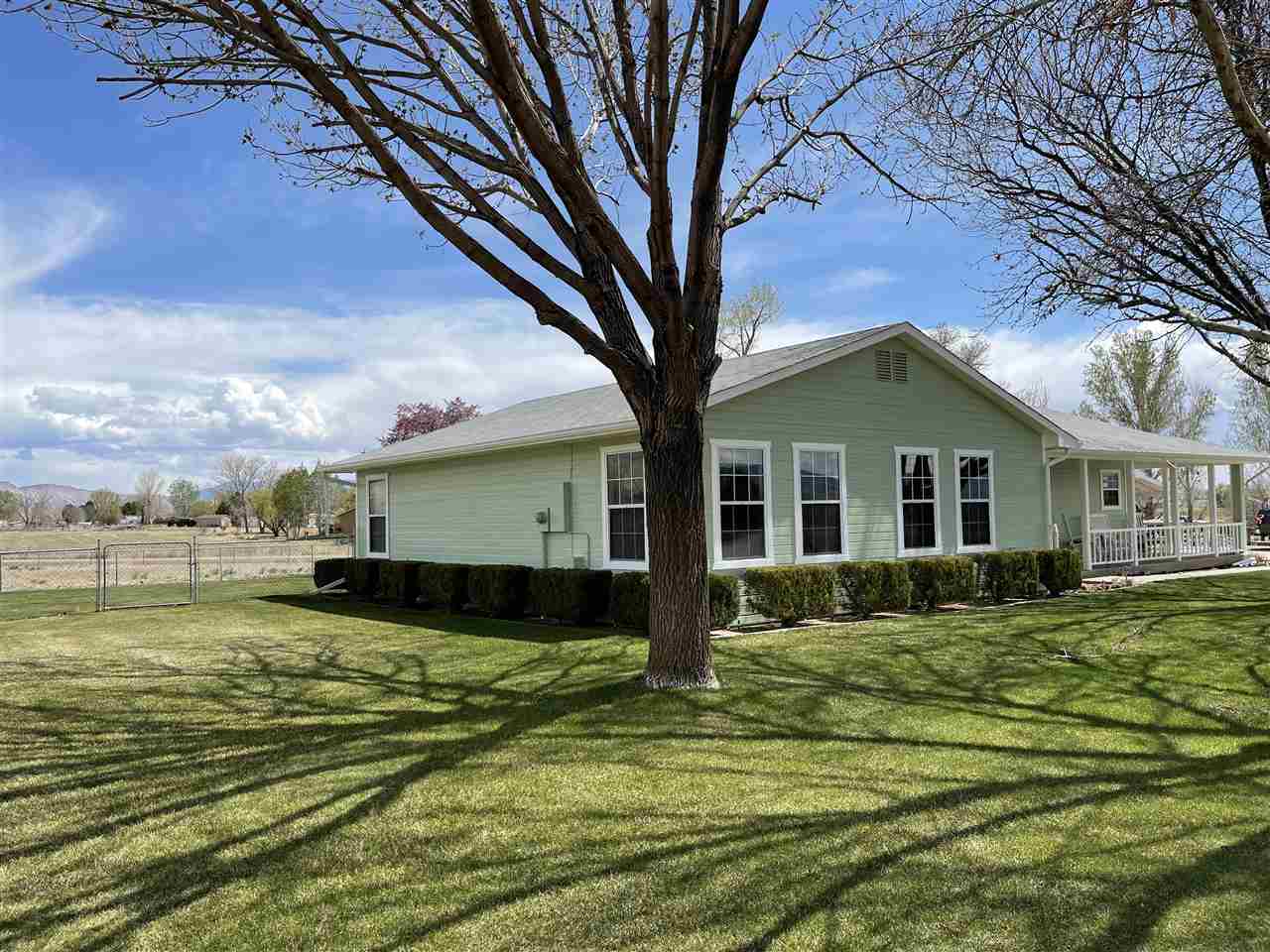 1144 23 Road Grand Junction, CO 81505 - Photo 3 of 29 a front view of a house with a yard